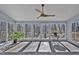 Bright sunroom featuring multiple windows, and tile floors at 6021 Dickson Mill Rd, Durham, NC 27705
