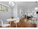 Bright dining area with a modern table and chairs, great natural light, and beautiful hardwood flooring at 608 Dowd St, Durham, NC 27701