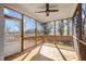 This screened-in porch is the perfect space for enjoying the outdoors with a ceiling fan and plenty of natural light at 608 Dowd St, Durham, NC 27701