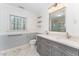 Bright bathroom with double vanity, modern fixtures, and marble flooring at 636 Palmer Dr, Sanford, NC 27330