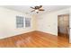 Spacious bedroom with hardwood floors, large closet, and ceiling fan at 636 Palmer Dr, Sanford, NC 27330