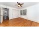 Bedroom featuring hardwood floors, closet, and windows providing natural light at 636 Palmer Dr, Sanford, NC 27330