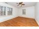 Bright bedroom with hardwood floors, white trim, and multiple windows for natural light at 636 Palmer Dr, Sanford, NC 27330