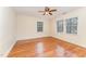 Bright bedroom featuring a ceiling fan, hardwood floors, and natural light at 636 Palmer Dr, Sanford, NC 27330