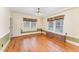 Bright dining room features wood paneling, hardwood floors, and natural light at 636 Palmer Dr, Sanford, NC 27330