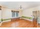 Traditional dining room featuring hardwood floors, wainscoting, and a decorative chandelier at 636 Palmer Dr, Sanford, NC 27330