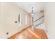 Bright foyer features hardwood floors, a staircase, and natural light through a large window at 636 Palmer Dr, Sanford, NC 27330