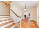 A grand foyer featuring hardwood floors, a staircase with white banisters, and an open view to the living room at 636 Palmer Dr, Sanford, NC 27330