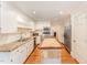 Bright kitchen features granite countertops, stainless steel appliances, and a butcher block island at 636 Palmer Dr, Sanford, NC 27330