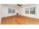 Bright living room with hardwood floors, white walls, and a cozy fireplace at 636 Palmer Dr, Sanford, NC 27330