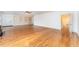 Large living room with hardwood floors, built-in shelving, and recessed lighting at 636 Palmer Dr, Sanford, NC 27330