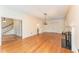 Open-concept living room featuring hardwood floors, fireplace, and seamless access to other living areas at 636 Palmer Dr, Sanford, NC 27330