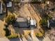 An aerial view of the property showcases the home, driveway, and mature trees at 707 Memorial Ave, Dunn, NC 28334