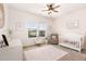 Charming Bedroom with a crib, rocking chair, and soft pink accents at 708 Pitchback Mill Ct Ct, Wake Forest, NC 27587