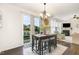 Cozy dining area with a stylish chandelier and sliding glass doors to the outdoor patio at 708 Pitchback Mill Ct Ct, Wake Forest, NC 27587