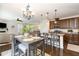 Cozy dining area adjacent to the kitchen features a stylish chandelier and comfortable seating at 708 Pitchback Mill Ct Ct, Wake Forest, NC 27587