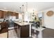 Modern kitchen with stainless steel appliances, granite countertops, and a convenient island with bar seating at 708 Pitchback Mill Ct Ct, Wake Forest, NC 27587