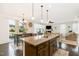 Open-concept kitchen with granite countertops, stainless steel appliances, and seamless flow into the living area at 708 Pitchback Mill Ct Ct, Wake Forest, NC 27587