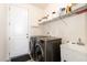 Well-equipped laundry room with modern washer and dryer, ample storage, and a utility sink at 708 Pitchback Mill Ct Ct, Wake Forest, NC 27587