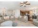 Spacious living room seamlessly connects to the kitchen, featuring plush sofas and neutral decor at 708 Pitchback Mill Ct Ct, Wake Forest, NC 27587