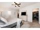 Bright main bedroom with a large dresser, TV, and walk-in closet at 708 Pitchback Mill Ct Ct, Wake Forest, NC 27587