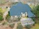 An aerial view showcasing the home's dark roof, backyard deck, and pergola at 7805 Fairlake Dr, Wake Forest, NC 27587
