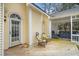 The backyard features a deck, chairs, hot tub in screened in porch, and a yellow home exterior at 7805 Fairlake Dr, Wake Forest, NC 27587