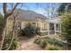 This home features a backyard with a wooden deck and a paved patio, perfect for outdoor entertaining at 7805 Fairlake Dr, Wake Forest, NC 27587