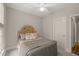Comfortable bedroom featuring neutral decor, soft carpet, and a ceiling fan at 7805 Fairlake Dr, Wake Forest, NC 27587