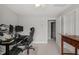 Functional bedroom area featuring a comfortable workspace with a view at 7805 Fairlake Dr, Wake Forest, NC 27587