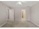 Light-filled bedroom featuring an en-suite bathroom and multiple entryways at 7805 Fairlake Dr, Wake Forest, NC 27587