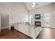 Bright living room featuring a cozy couch, fireplace, and hardwood floors at 7805 Fairlake Dr, Wake Forest, NC 27587