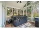 Screened in porch with hot tub, foliage views, and neutral tones at 7805 Fairlake Dr, Wake Forest, NC 27587