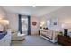 Cozy Bedroom with white crib, neutral tones, and decorative accents create a soothing atmosphere at 8711 Wardle Ct, Raleigh, NC 27616
