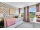 Bright bedroom featuring butterfly wallpaper, a daybed, and soft pink accents, perfect for a room at 8715 Wardle Ct, Raleigh, NC 27616