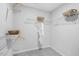 Walk-in closet featuring multiple shelves and bars for organization at 8715 Wardle Ct, Raleigh, NC 27616