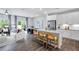 Open concept kitchen with island seating flows into a living and dining area at 8715 Wardle Ct, Raleigh, NC 27616