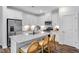 Bright kitchen featuring white cabinets, stainless steel appliances, and a speckled granite countertop at 8715 Wardle Ct, Raleigh, NC 27616