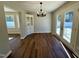 Bright dining room area featuring light fixture, and glass door leading to outside area at 100 N 6Th St, Erwin, NC 28339