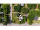 Aerial view of a well-maintained home surrounded by lush greenery and neighborhood streets at 1000 S 9Th St, Lillington, NC 27546