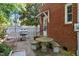 Outdoor patio features a stainless steel grill, stone table, and seating for comfortable outdoor entertaining at 1000 S 9Th St, Lillington, NC 27546