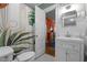 Bright bathroom featuring a modern vanity, stylish mirror, and a shower with a decorative curtain at 1000 S 9Th St, Lillington, NC 27546