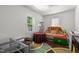 Cozy room with a stuffed tiger on a sofa, round table, and view of the outdoor greenery at 1000 S 9Th St, Lillington, NC 27546