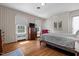 Serene bedroom with hardwood floors, ample natural light, and a comfortable bed at 1000 S 9Th St, Lillington, NC 27546