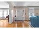 Welcoming entryway featuring a white door, sidelights, and hardwood flooring with a decorative rug at 1000 S 9Th St, Lillington, NC 27546