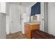 Small kitchenette featuring a compact refrigerator, sink, and cabinetry perfect for light cooking at 1000 S 9Th St, Lillington, NC 27546