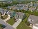 Beautiful aerial view of a home, showcasing its landscaped yard and neighborhood at 1021 Traditions Meadow Dr, Wake Forest, NC 27587