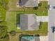 Aerial view of a well-maintained roof and backyard of a home surrounded by lush green lawns at 1021 Traditions Meadow Dr, Wake Forest, NC 27587