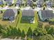 Expansive backyard of home features lush lawn with basketball hoop, patio, and privacy fence at 1021 Traditions Meadow Dr, Wake Forest, NC 27587