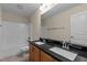 Bathroom with double sinks, granite countertop, and tub shower combo at 1021 Traditions Meadow Dr, Wake Forest, NC 27587